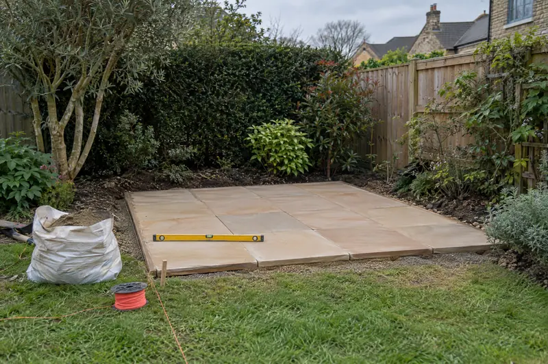 Newly laid paved base for a garden sauna