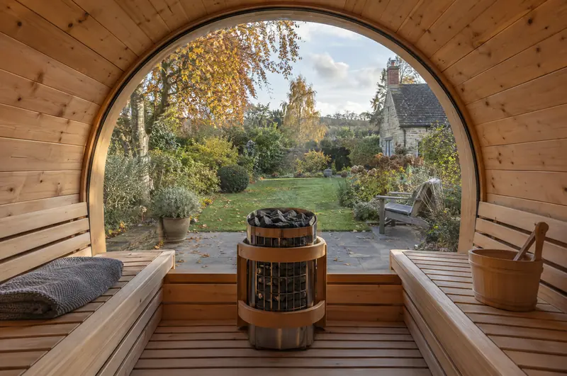 View from inside a sauna pod through its glass end to the garden