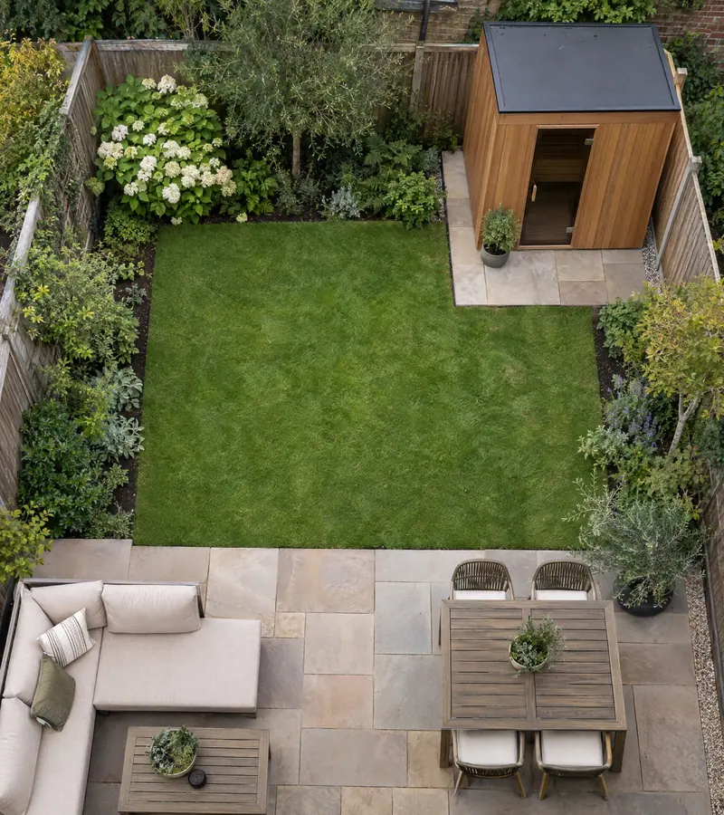 Overhead view of a small garden with a compact sauna in one corner